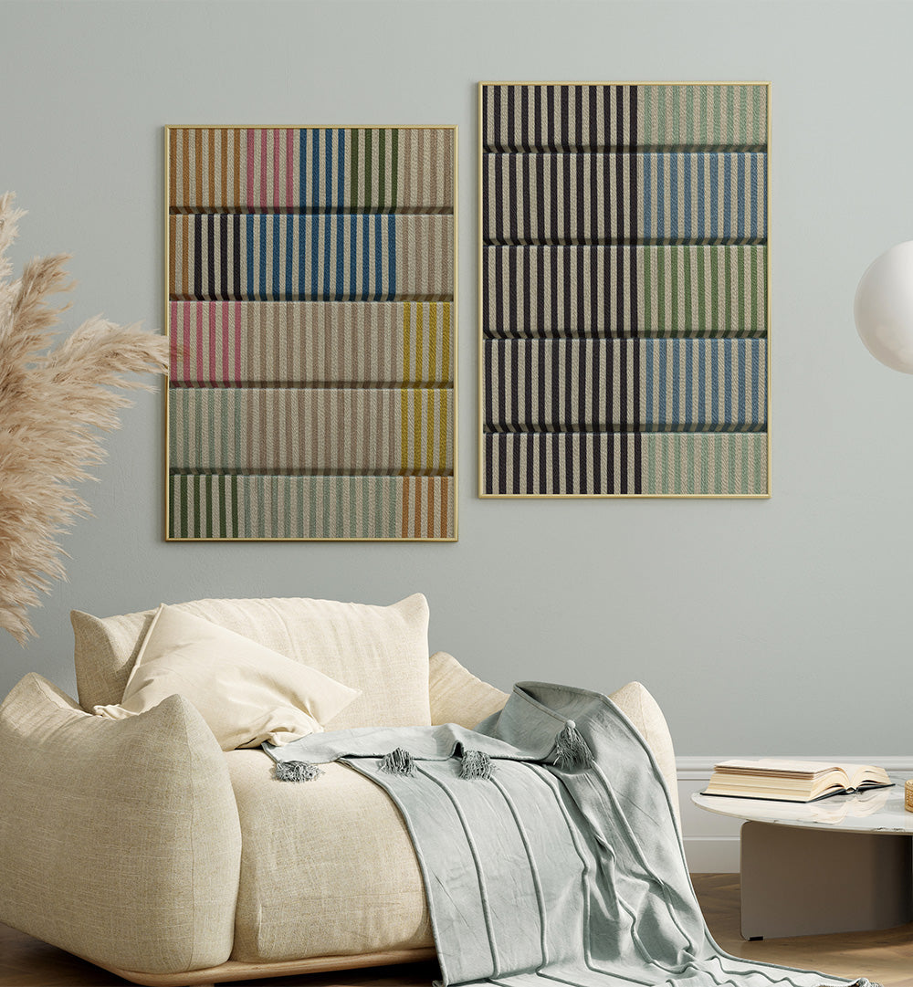 Two abstract wall hangings above a bed in a bedroom setting.