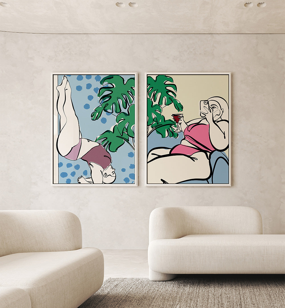 Two abstract art prints of women in swimsuits hanging on a wall above a sofa.