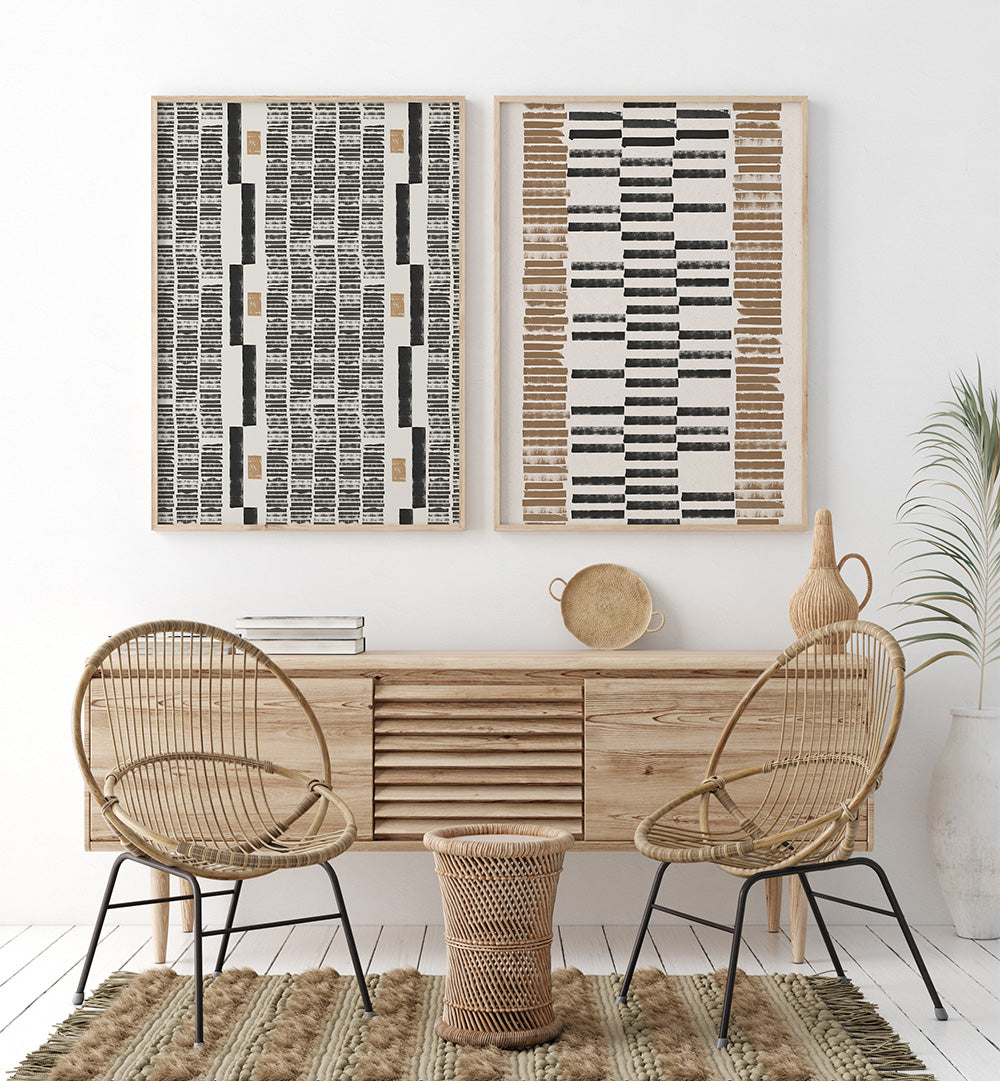 Modern interior with wooden console table, wicker chairs, and abstract wall art.