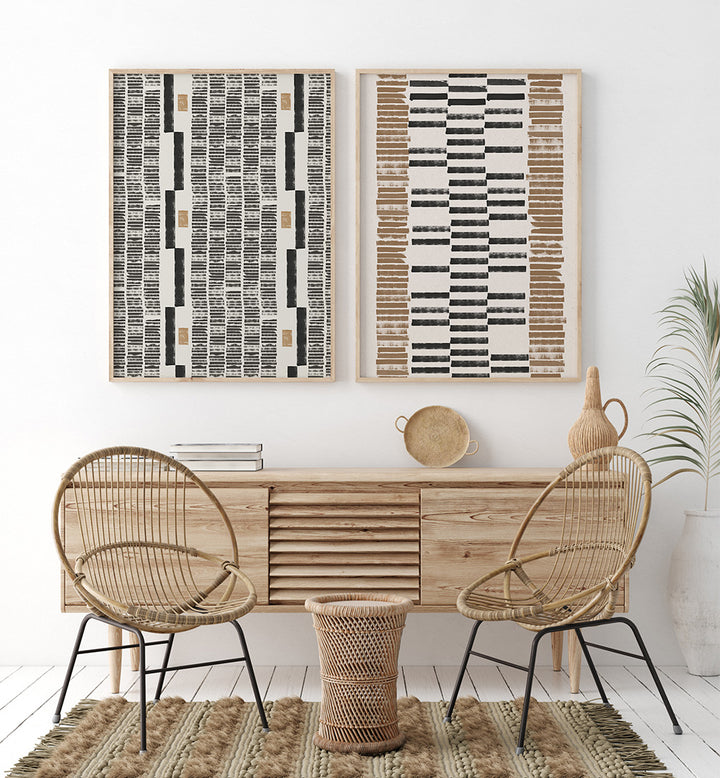 Modern interior with wooden console table, wicker chairs, and abstract wall art.