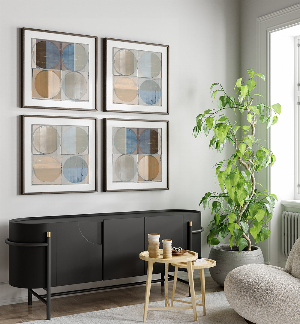 Modern living room with black sideboard, round tables, and abstract wall art.