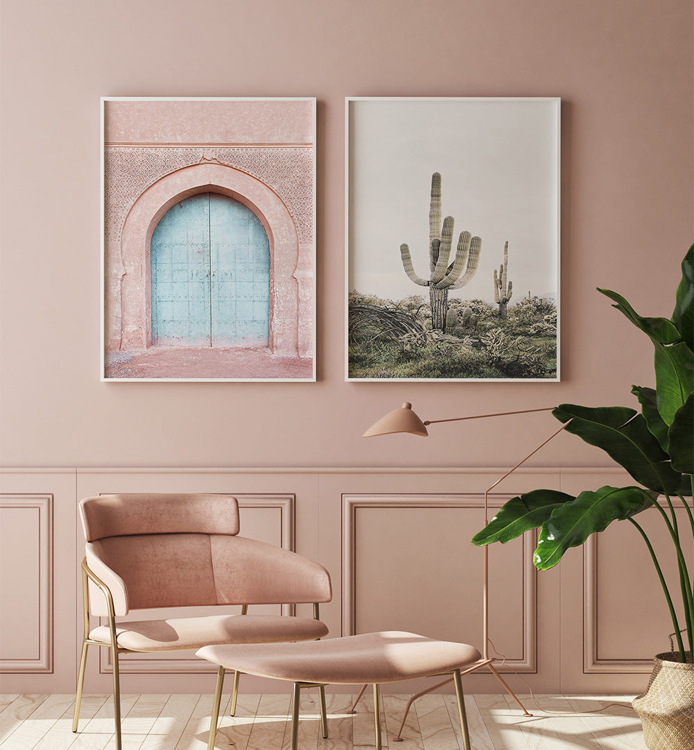 Modern interior with pink walls, a chair, and framed artworks.