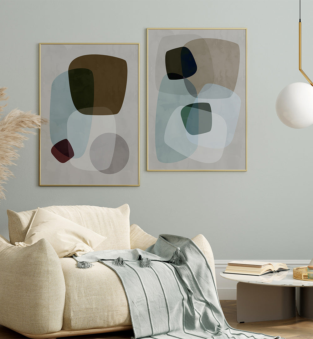 Modern living room with abstract art on the wall and a beige sofa.