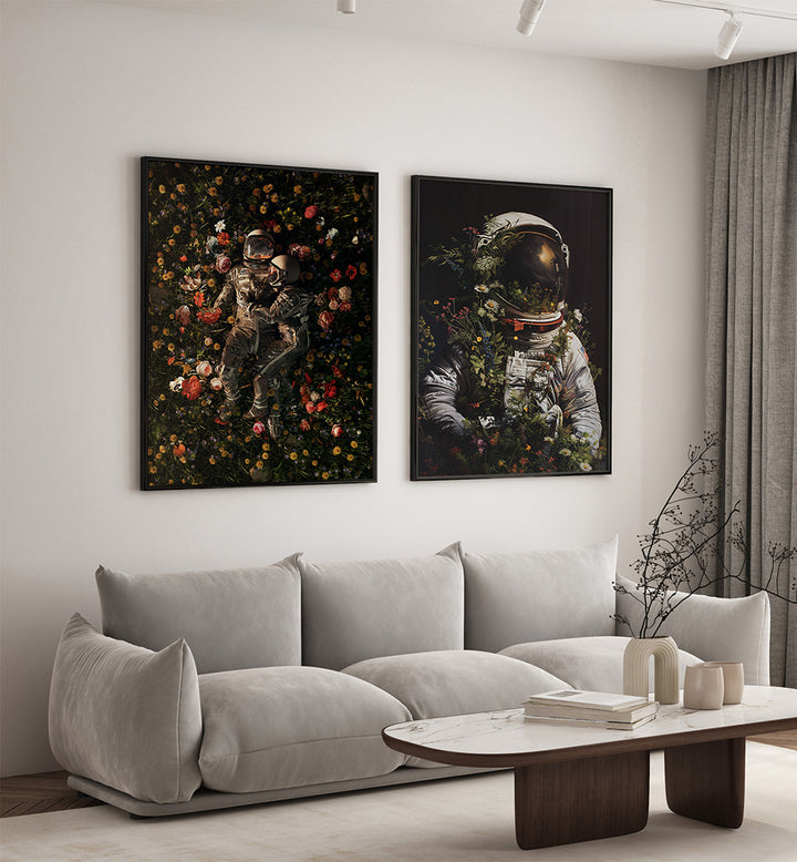 Living room with a gray sofa, coffee table, and two framed artworks of astronauts in space.