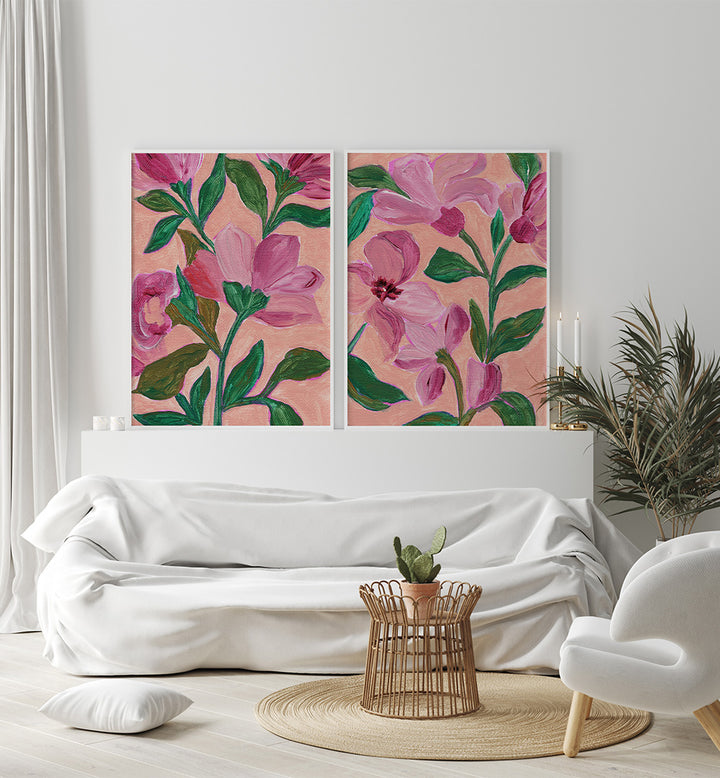 Floral artwork on a wall above a white sofa in a living room.