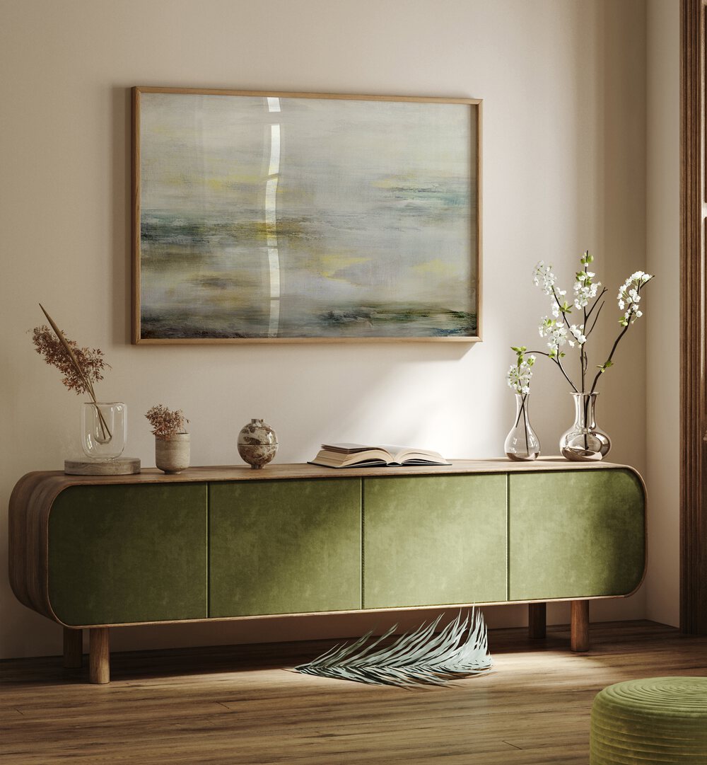 Elegant living space featuring a BLEND OF MUTED TONES, ABSTRACT PAINTINGS above a stylish green sideboard.