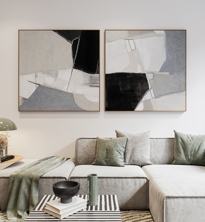 Modern living room with abstract art on the wall and a gray sofa.