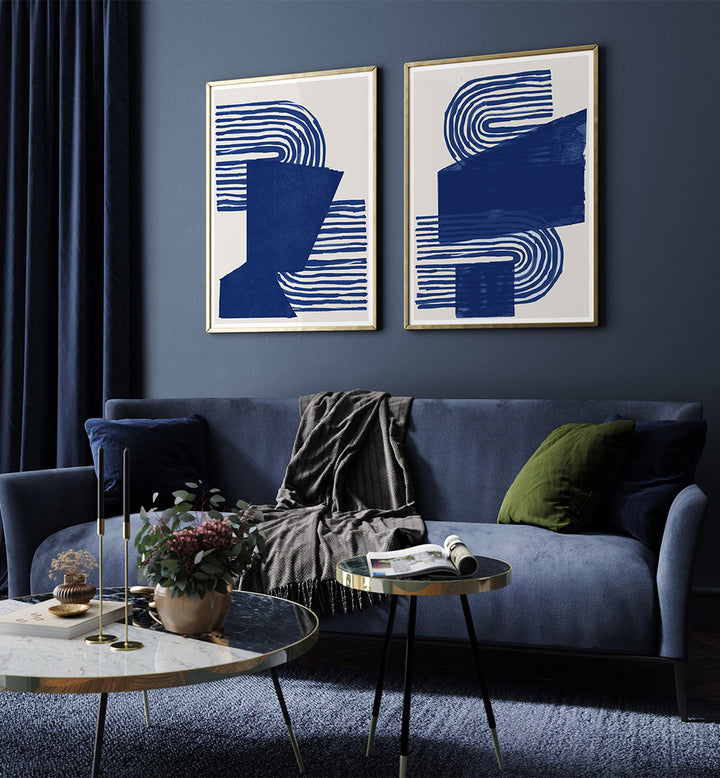Modern living room with abstract art, a blue sofa, and decorative items.