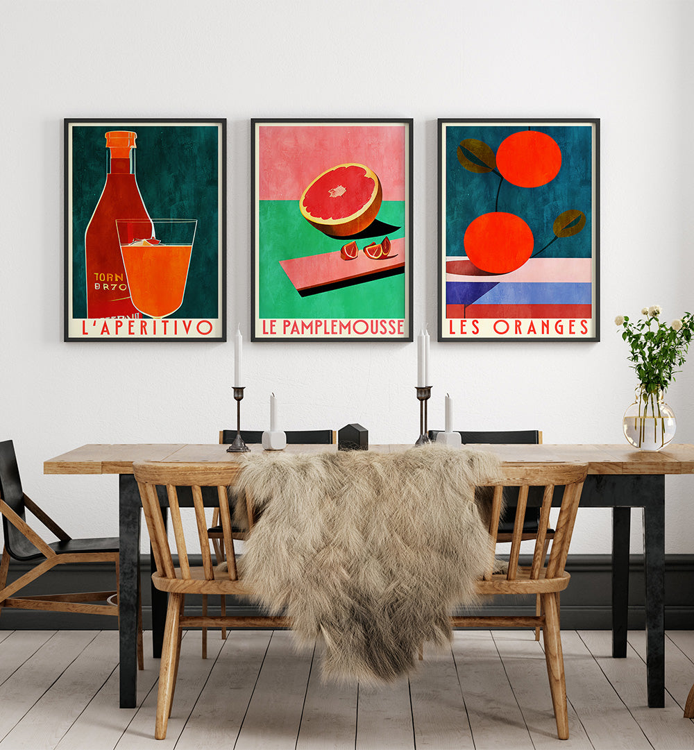 Dining room with wooden table and chairs, featuring colorful abstract art prints on the wall.