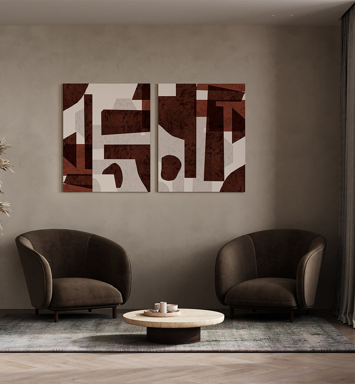 Modern living room with abstract art, two brown armchairs, and a round coffee table.