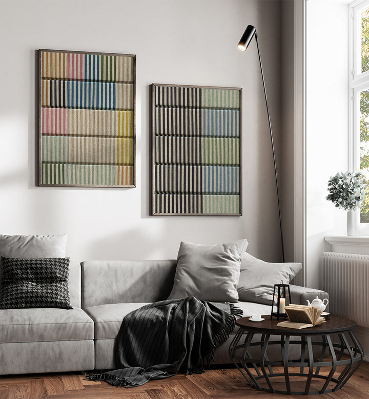 Modern living room with a gray sofa, coffee table, and abstract wall art.