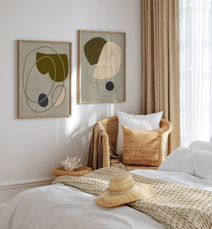 Cozy bedroom with abstract art, wicker chair, and straw hat on bed