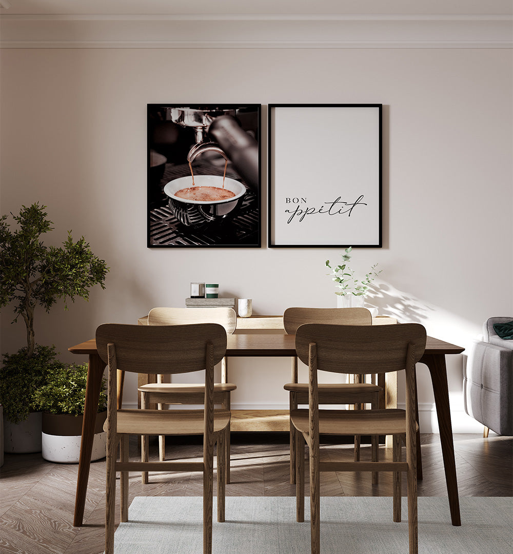 Dining room with wooden table and chairs, framed art on the wall.