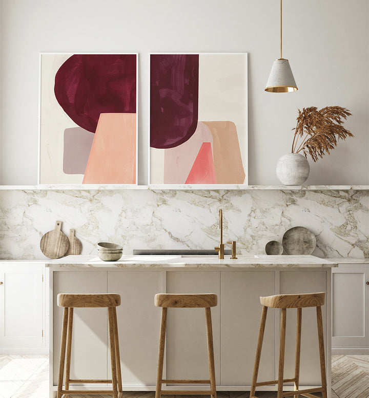 Modern kitchen with abstract art on the wall, marble countertop, and wooden stools.