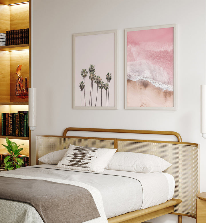 Bedroom with a wooden headboard, white bedding, and two framed artworks on the wall.