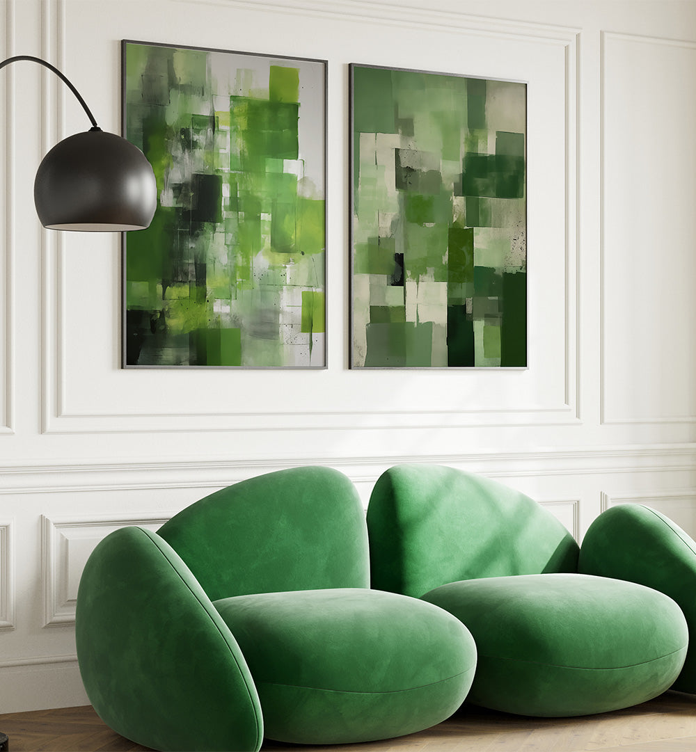 Green modern sofa in a room with abstract green and white paintings on the wall.