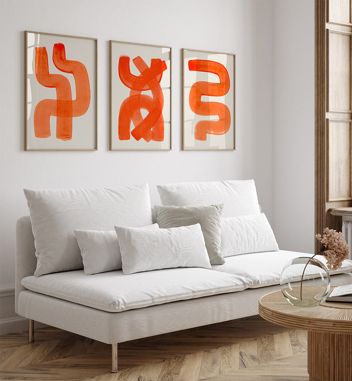 Modern living room with a white sofa, wooden coffee table, and abstract orange art on the wall.