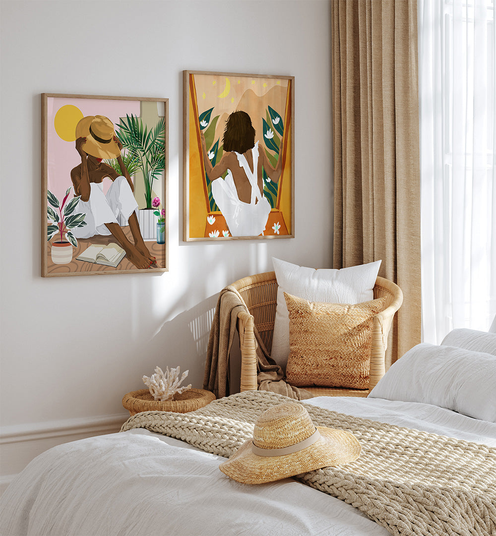 Bedroom with two framed artworks on the wall, a bed with a straw hat and blanket, and a window with curtains.