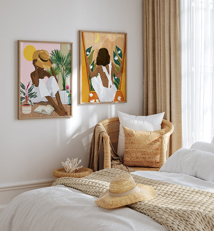 Bedroom with two framed artworks on the wall, a bed with a straw hat and blanket, and a window with curtains.