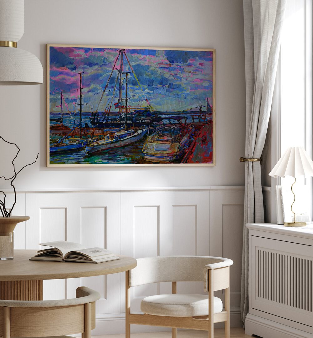 Vibrant YACHTS , LANDSCAPE PAINTINGS adorn the wall, enhancing the elegance of this stylish interior space.