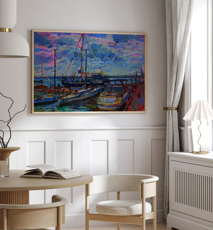 Vibrant YACHTS , LANDSCAPE PAINTINGS adorn the wall, enhancing the elegance of this stylish interior space.