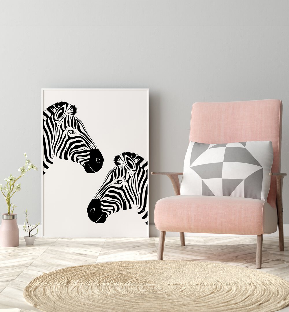 Two Zebras by Martina Wildlife Poster  placed on wall near pink sofa
