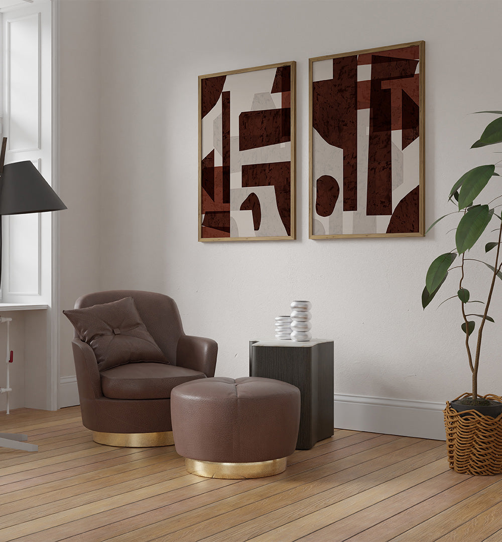 Modern living room with brown armchair, ottoman, and abstract wall art.