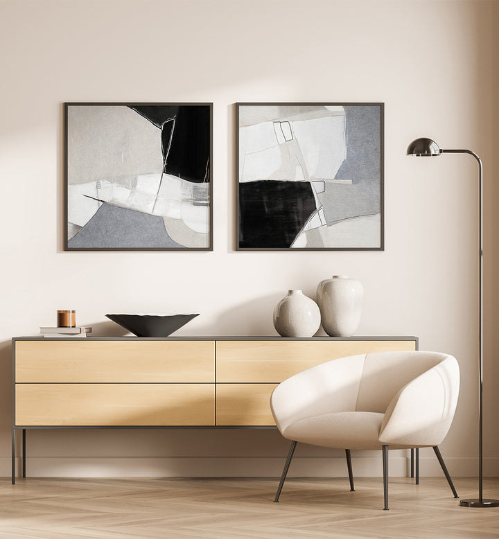 Modern interior with abstract art, a sideboard, and a chair.
