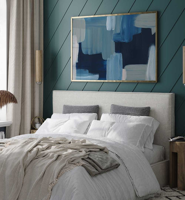 Framed BRUSH STROKES , ABSTRACT PAINTINGS in blue tones hanging above bed in a modern teal bedroom