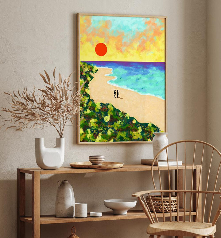 Vibrant GOLDEN GLOW, LANDSCAPE PAINTINGS adorn the wall, capturing a serene beach scene with sunset hues.