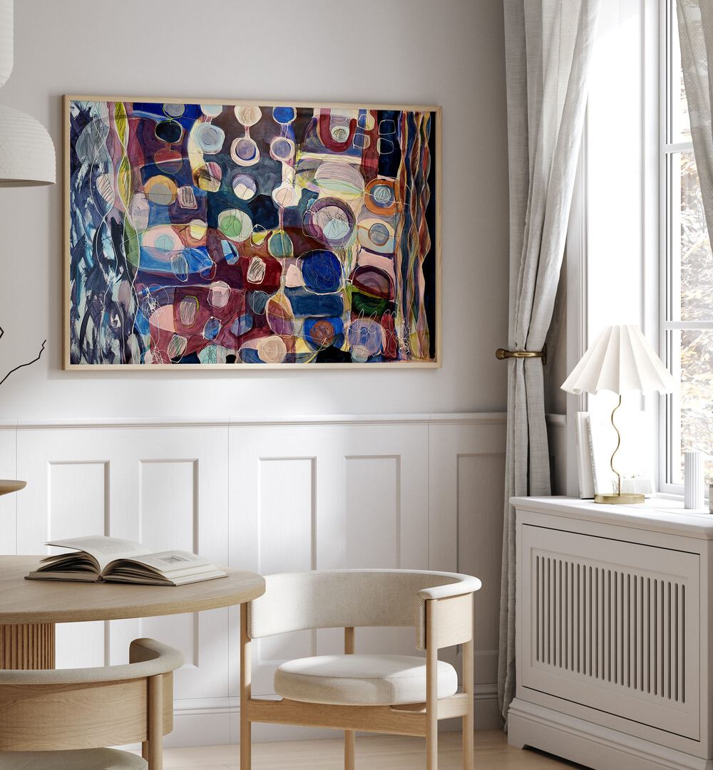 Colorful ELEMENTS ORGANISEES I, ABSTRACT PAINTINGS adorn a stylish room, enhancing the artistic ambiance beautifully.