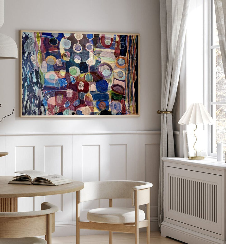 Colorful ELEMENTS ORGANISEES I, ABSTRACT PAINTINGS adorn a stylish room, enhancing the artistic ambiance beautifully.