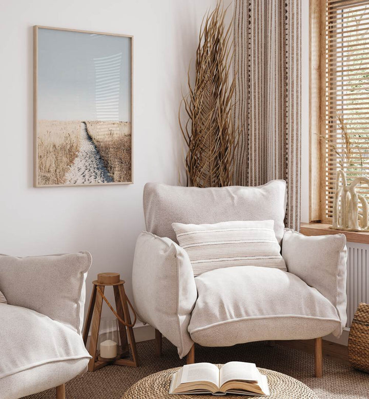 Cozy living space featuring "TO THE BEACH, BEACH PAINTINGS" that evoke sunlit coastal vibes and relaxation.