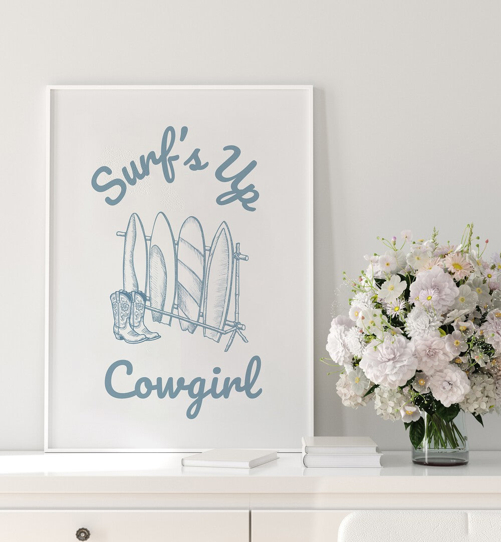 Stylish SURFS UP COWGIRL, BEACH PAINTINGS featuring surfboards and cowboy boots, perfect for adventurous decor.