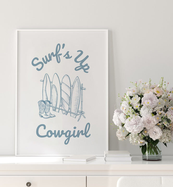 Stylish SURFS UP COWGIRL, BEACH PAINTINGS featuring surfboards and cowboy boots, perfect for adventurous decor.