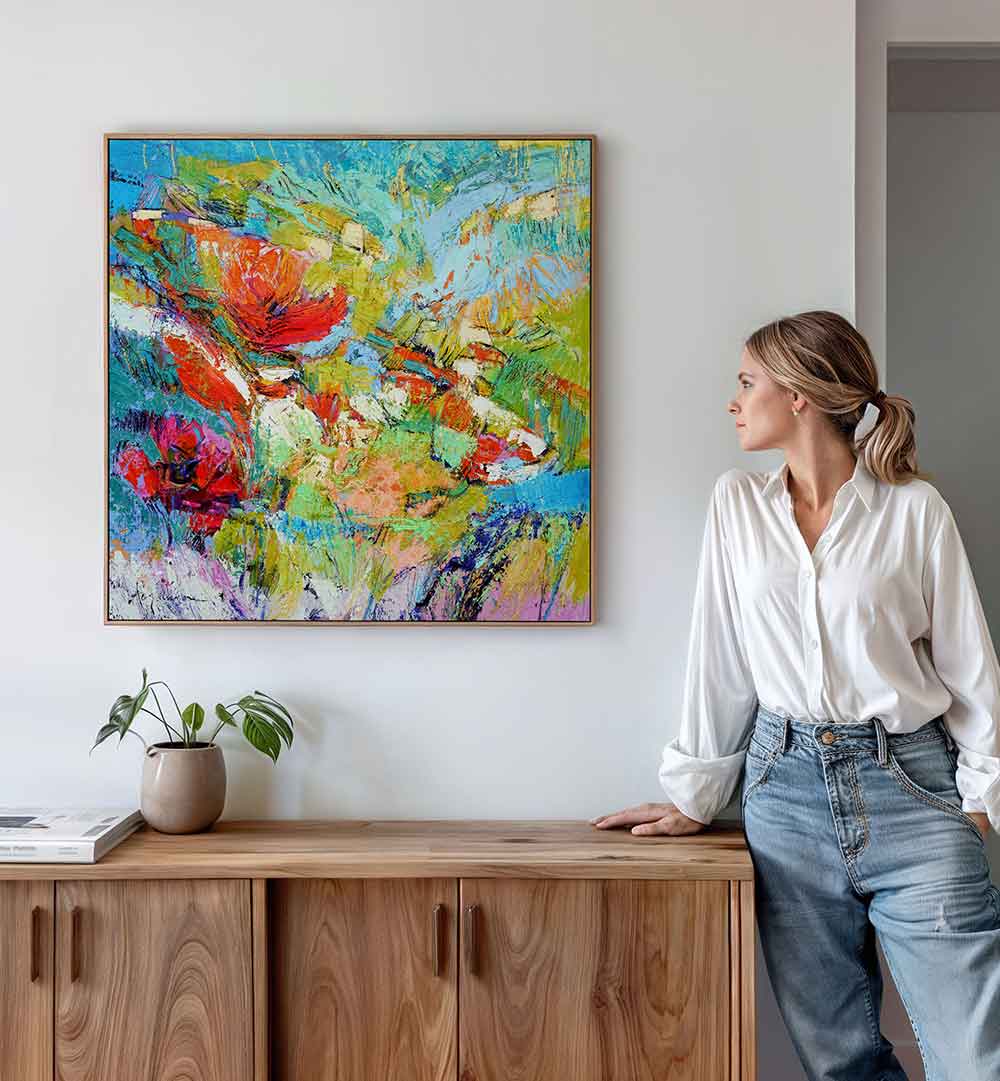 FLORAL HARMONY BURST , ABSTRACT PAINTINGS vibrant floral abstract on wall above wood console, woman viewing