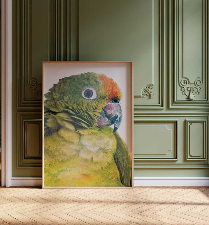 PARROT GLANCE , ANIMAL PAINTINGS — vibrant green-orange parrot portrait in frame leaning against ornate green wall
