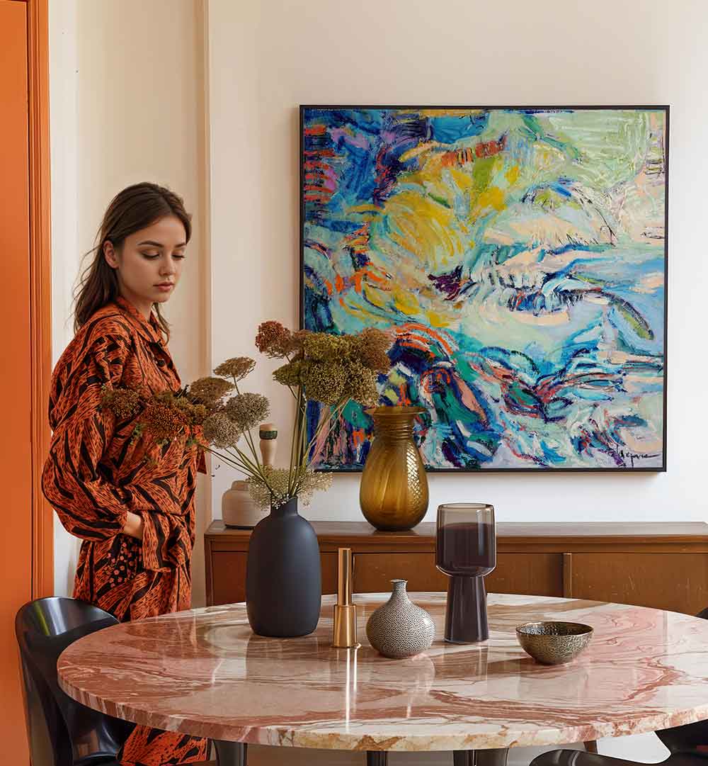 FLOWING HUES , ABSTRACT PAINTINGS vibrant canvas above marble dining table with vases and woman admiring
