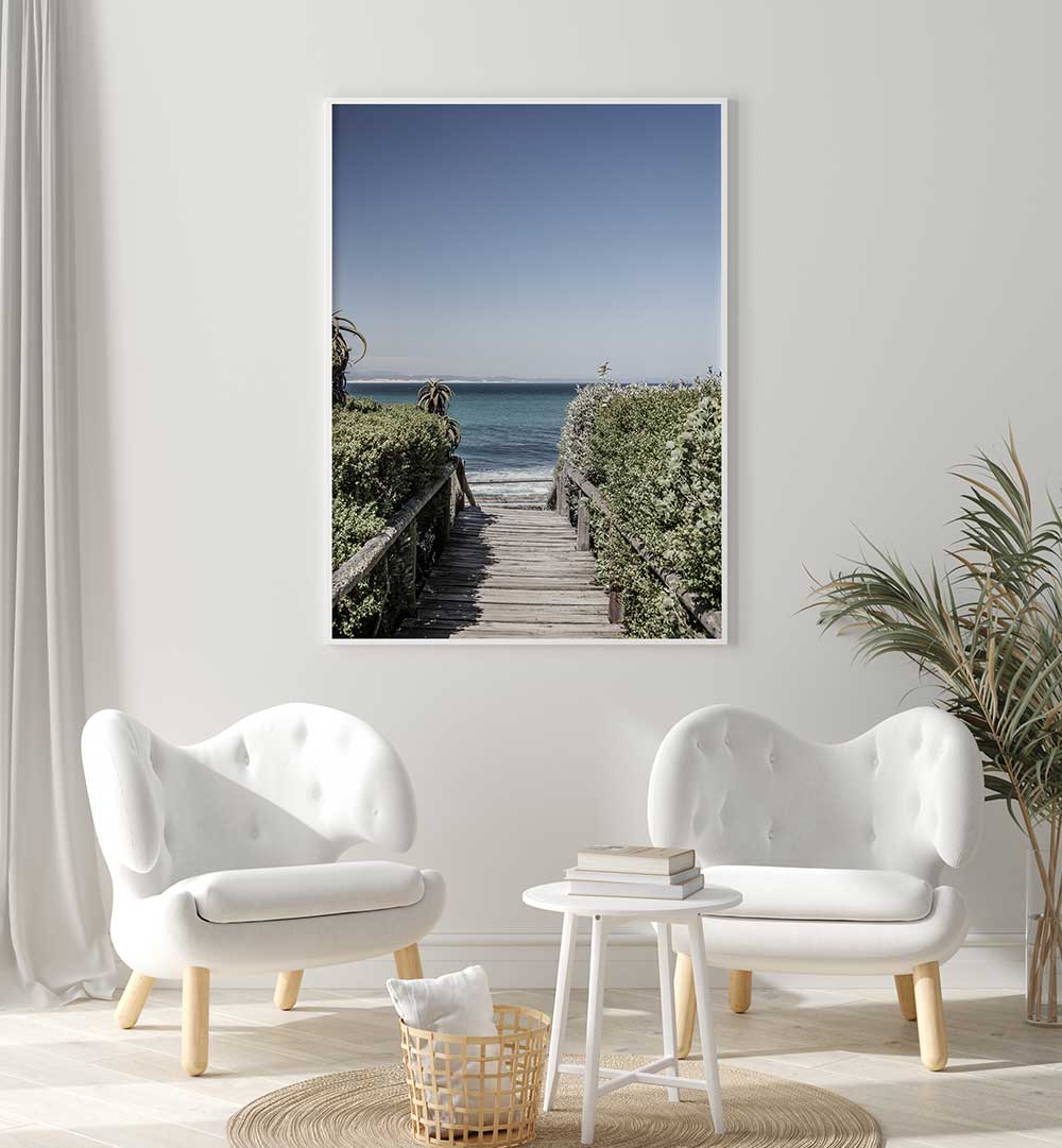 SEASIDE TRANQUILITY , BEACH PAINTINGS framed coastal boardwalk print over white chairs in modern living room