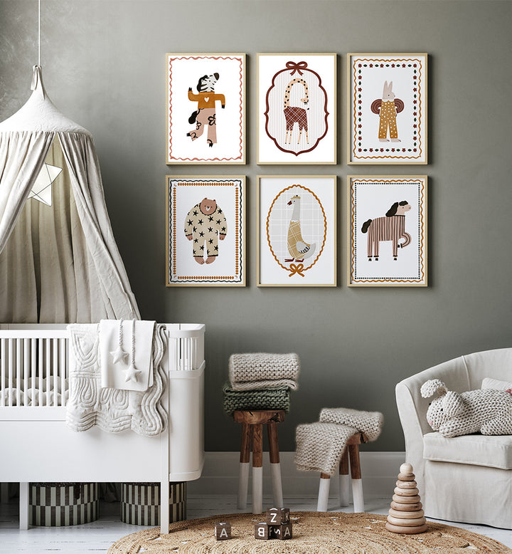 Nursery room with framed animal prints on the wall, crib, and toys.