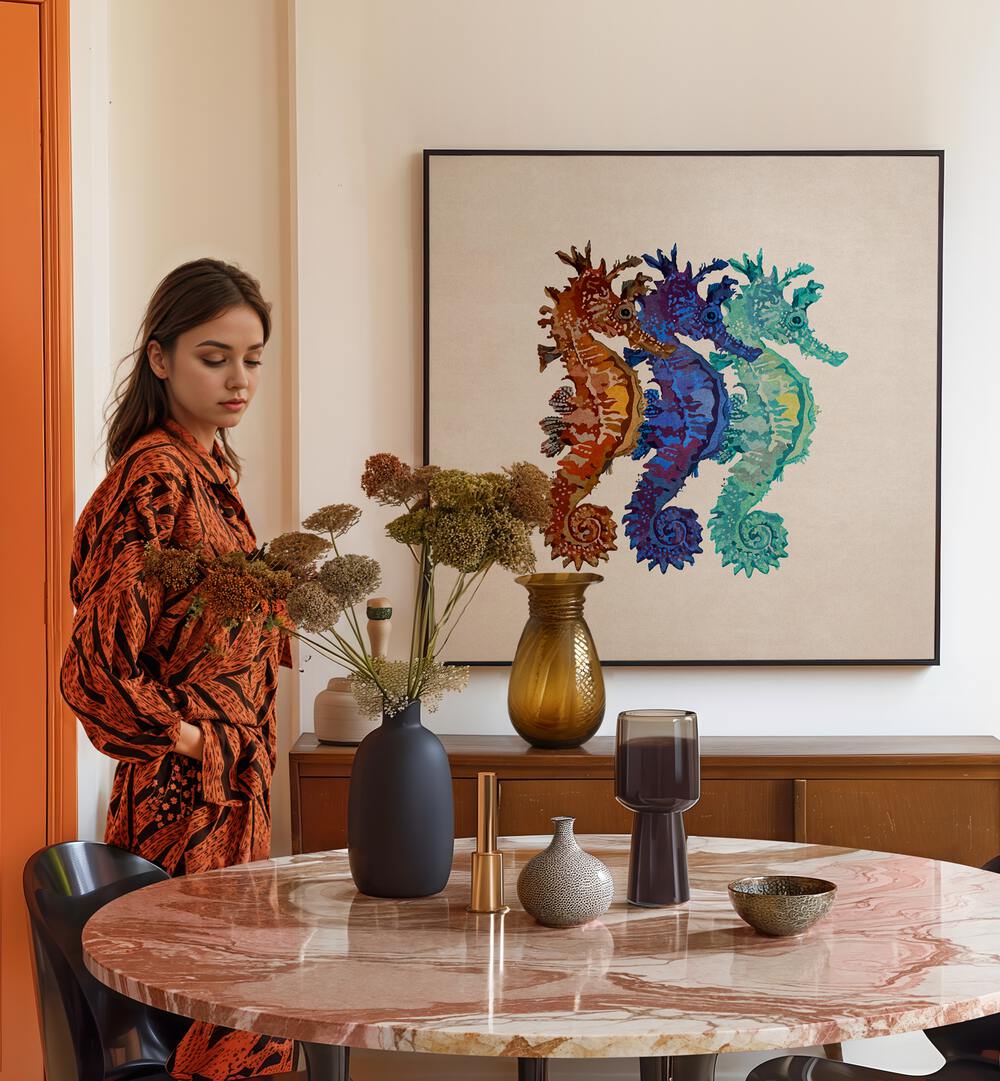 Colorful DENIZATLARI, BEACH PAINTINGS by Emel Tunaboylu enhance modern decor in a stylish home setting.