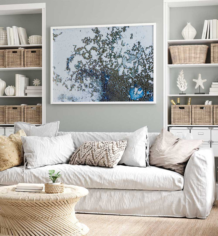 CORAL RISING, ABSTRACT PAINTINGS showcased above a cozy sofa, enhancing the room with vibrant colors and dynamic shapes.