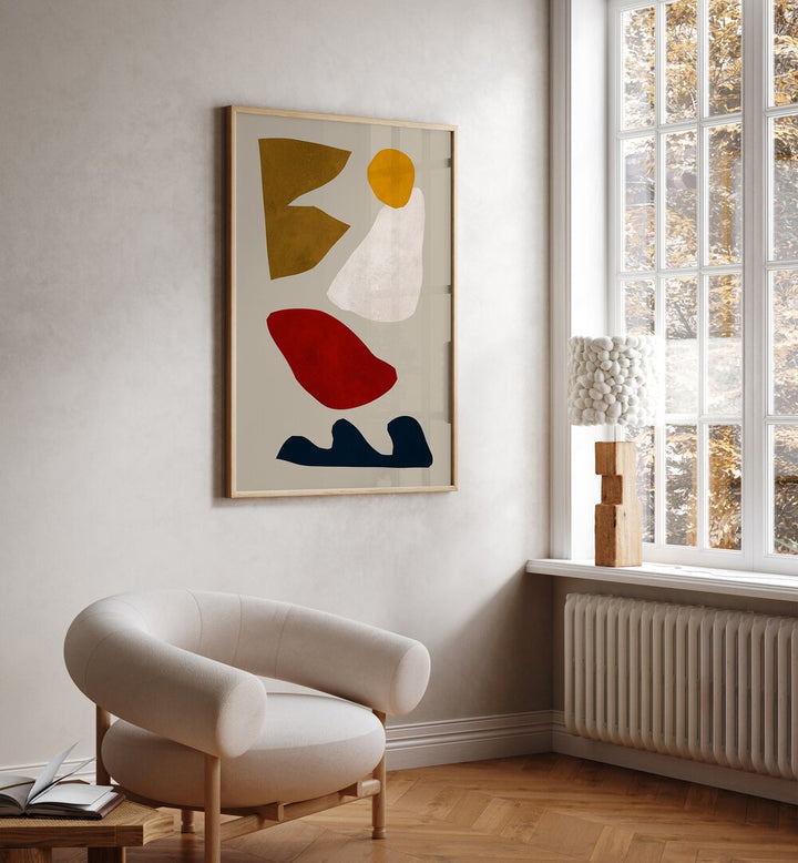 Colorful abstract shapes decorate the wall in this home, showcasing the EXPRESSIVE GEO IV, GEOMETRIC ART PRINTS.