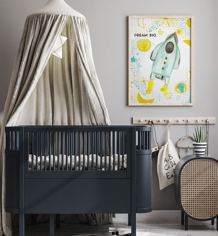 Bright and playful DREAM BIG, KIDS ROOM PAINTINGS enhance a cozy nursery with whimsical rocket art.