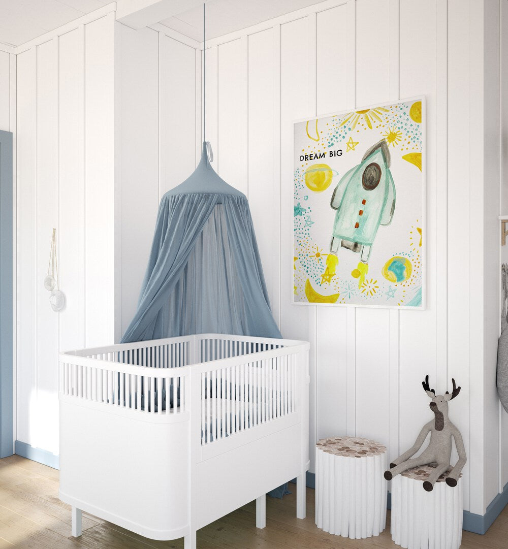 Bright and whimsical DREAM BIG, KIDS ROOM PAINTINGS enhance a cozy nursery with a playful rocket theme.