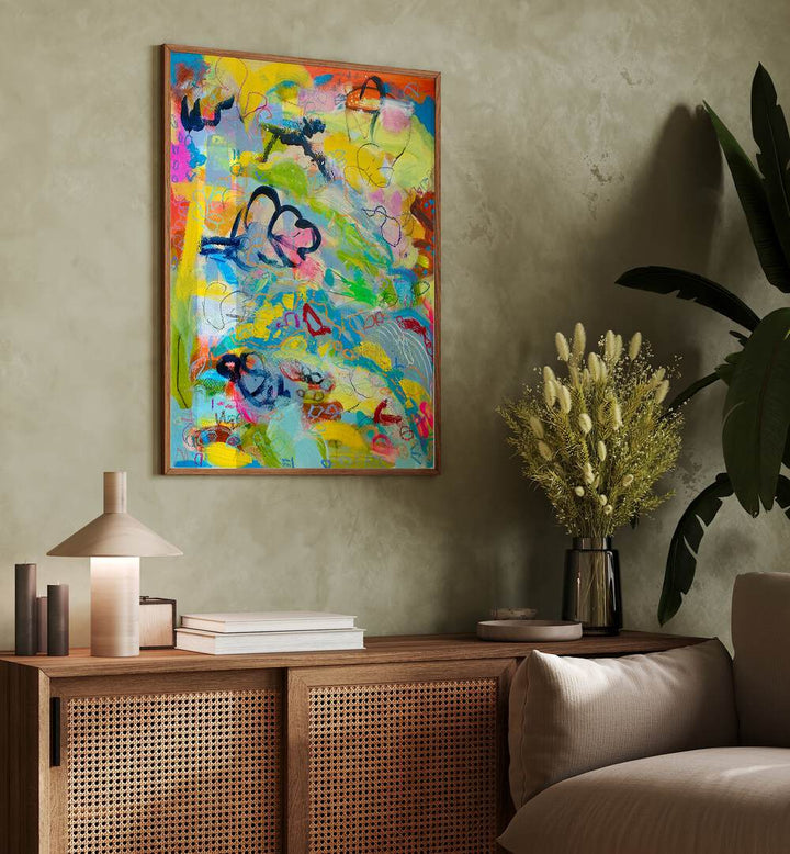 Vibrant FRUITS OF LABOR, ABSTRACT PAINTINGS adorn a stylish living space, celebrating art's emotional resonance.