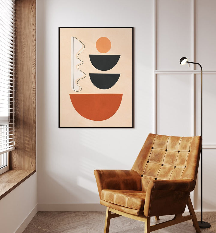 Bright and modern SEMICIRCLES II, BOHO ART PAINTINGS displayed above a cozy chair, adding a touch of geometric style.