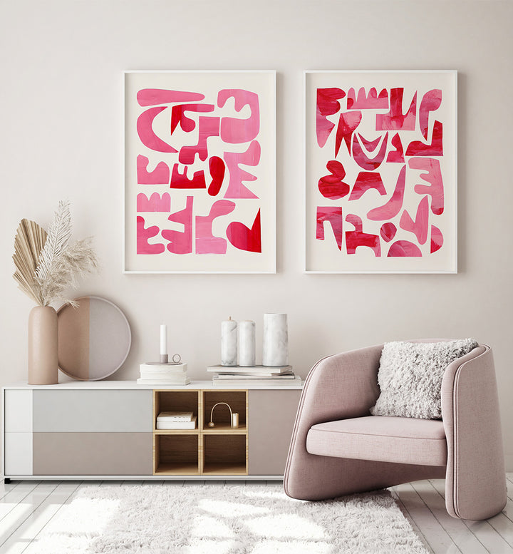Modern living room with abstract pink and red wall art, a beige armchair, and a white sideboard.