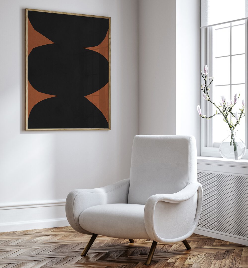 Stylish TRIBAL VII, GEOMETRIC ART PRINTS displayed above a cozy chair, enhancing modern decor with bold designs.