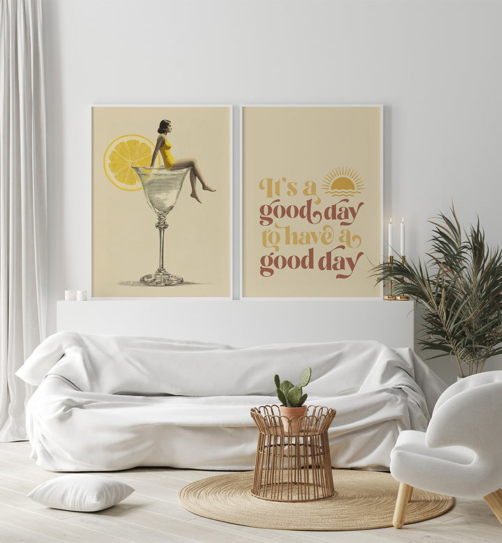 Modern living room with white sofa, decorative pillows, and wall art featuring a woman sitting on a lemon slice and a motivational quote.